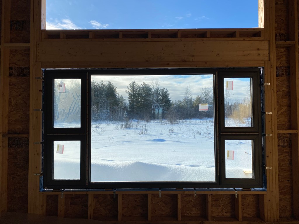 Picture looking out window from inside house under construction
