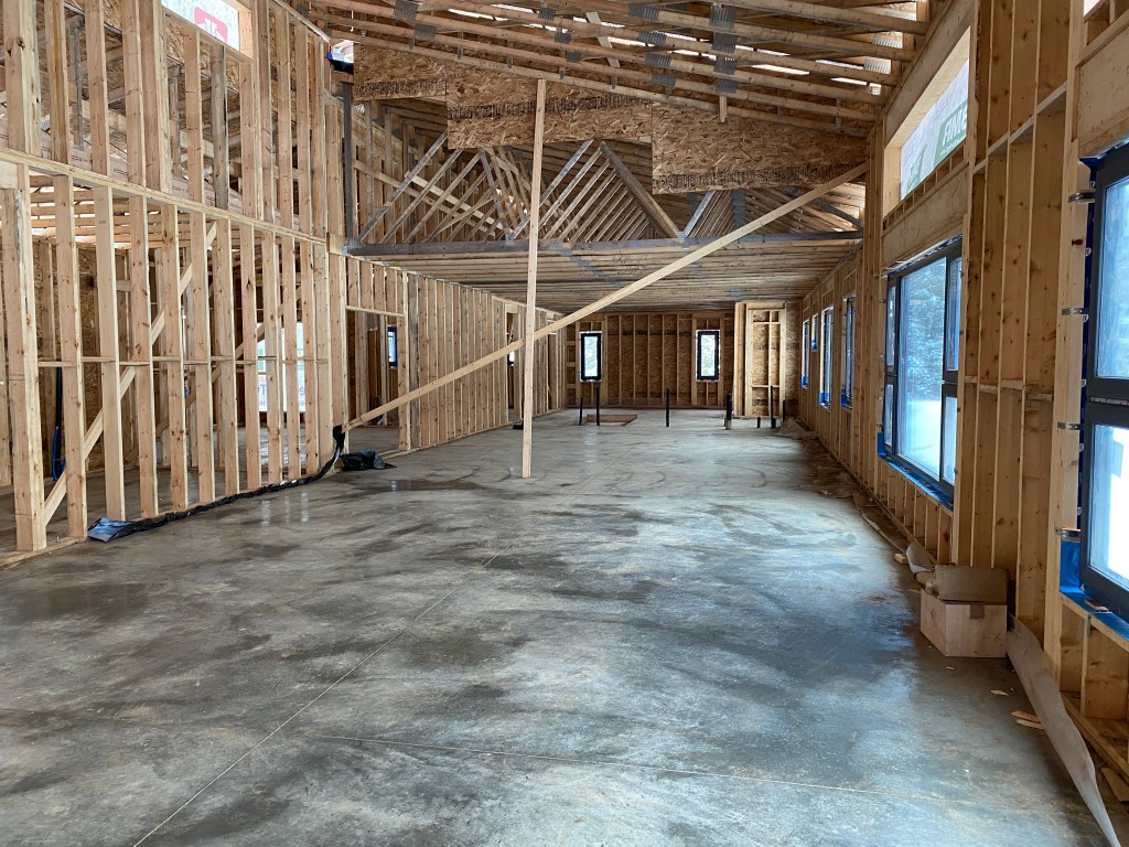 Picture of freshly swept concrete floor in house under construction
