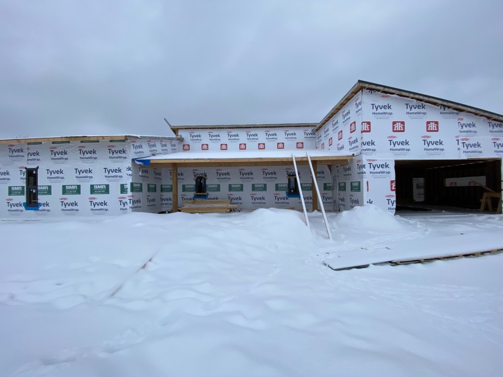 Picture of house under construction with Tyvek weather barrier