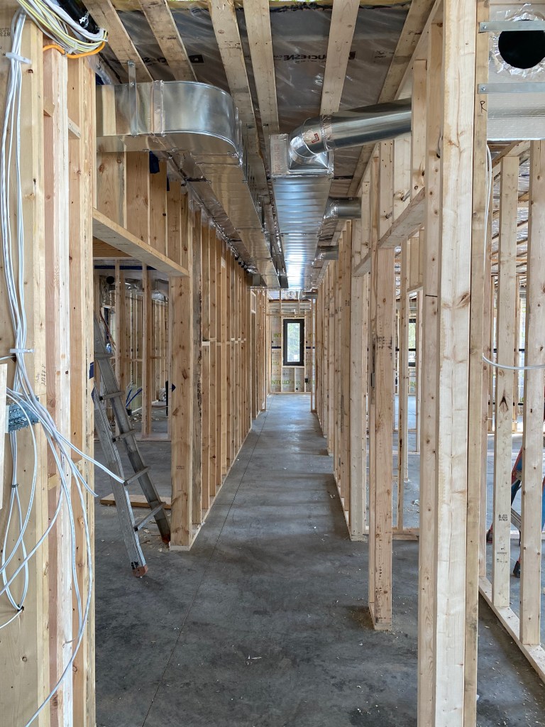 Image of exposed ducts in house under construction