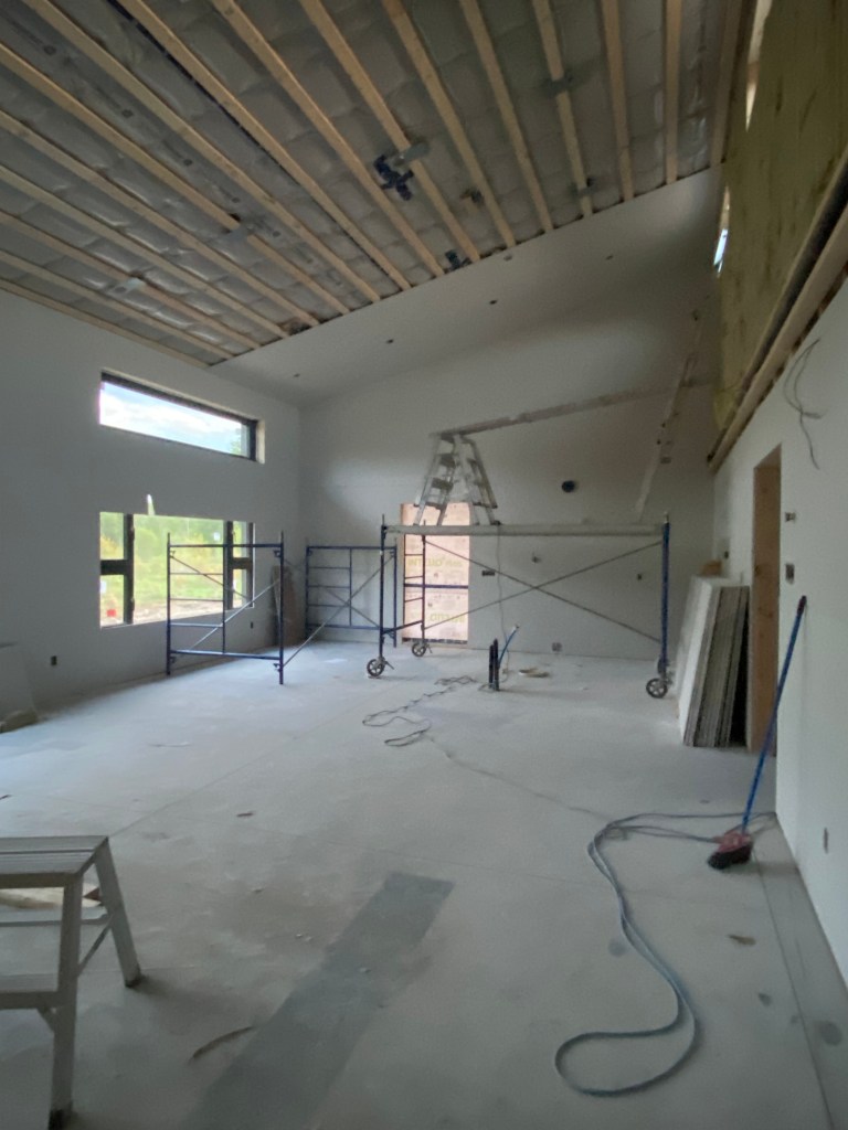 Image of living room with drywall being installed