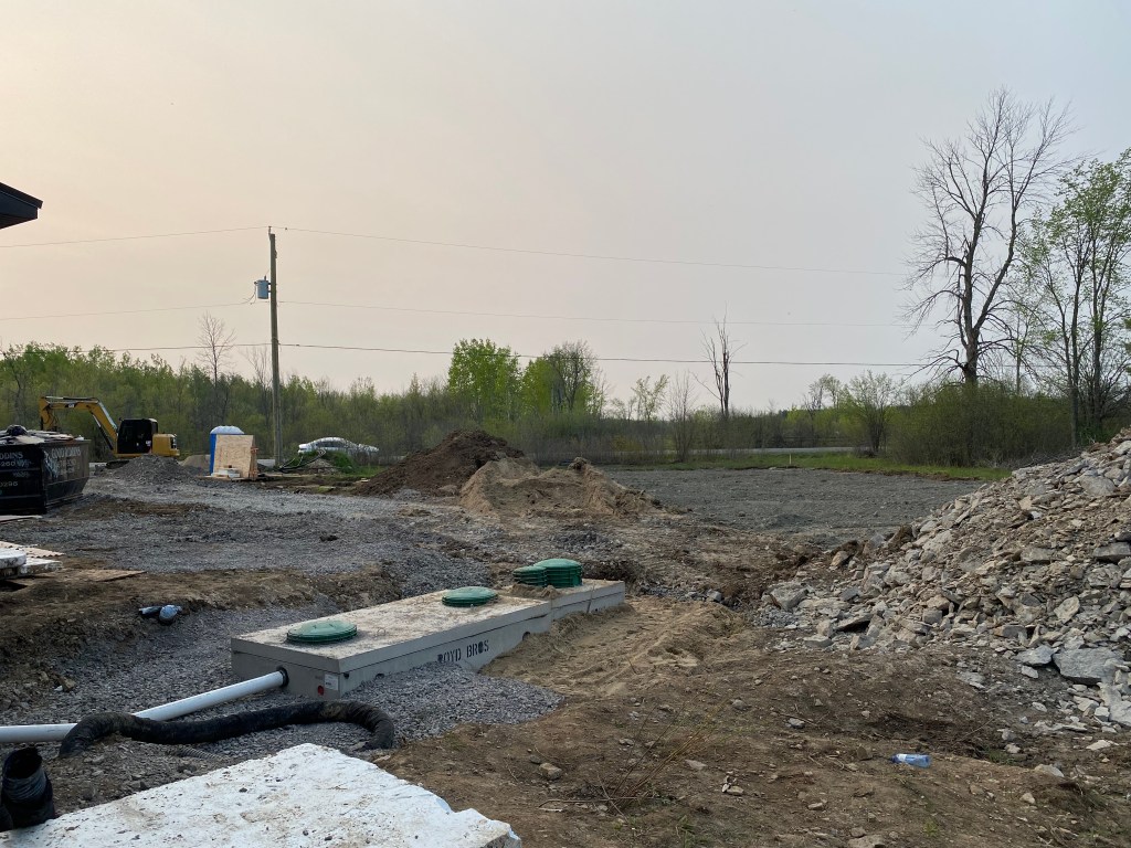 Picture of septic tank and dosing chamber being installed