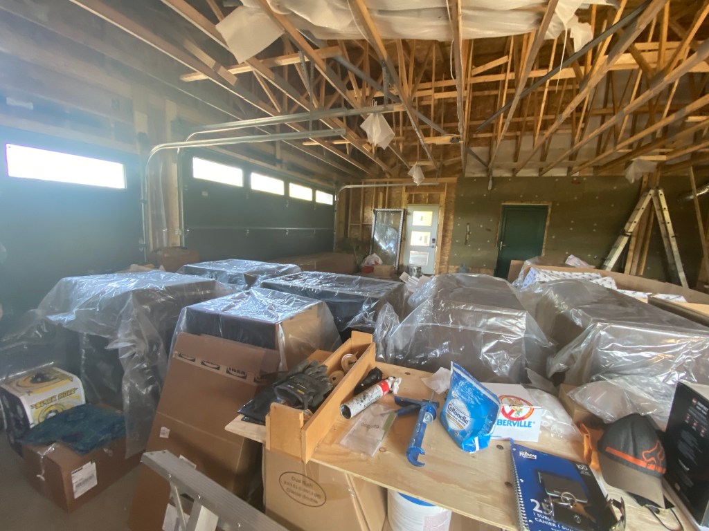 Picture of garage with stacks of ikea cabinet boxes